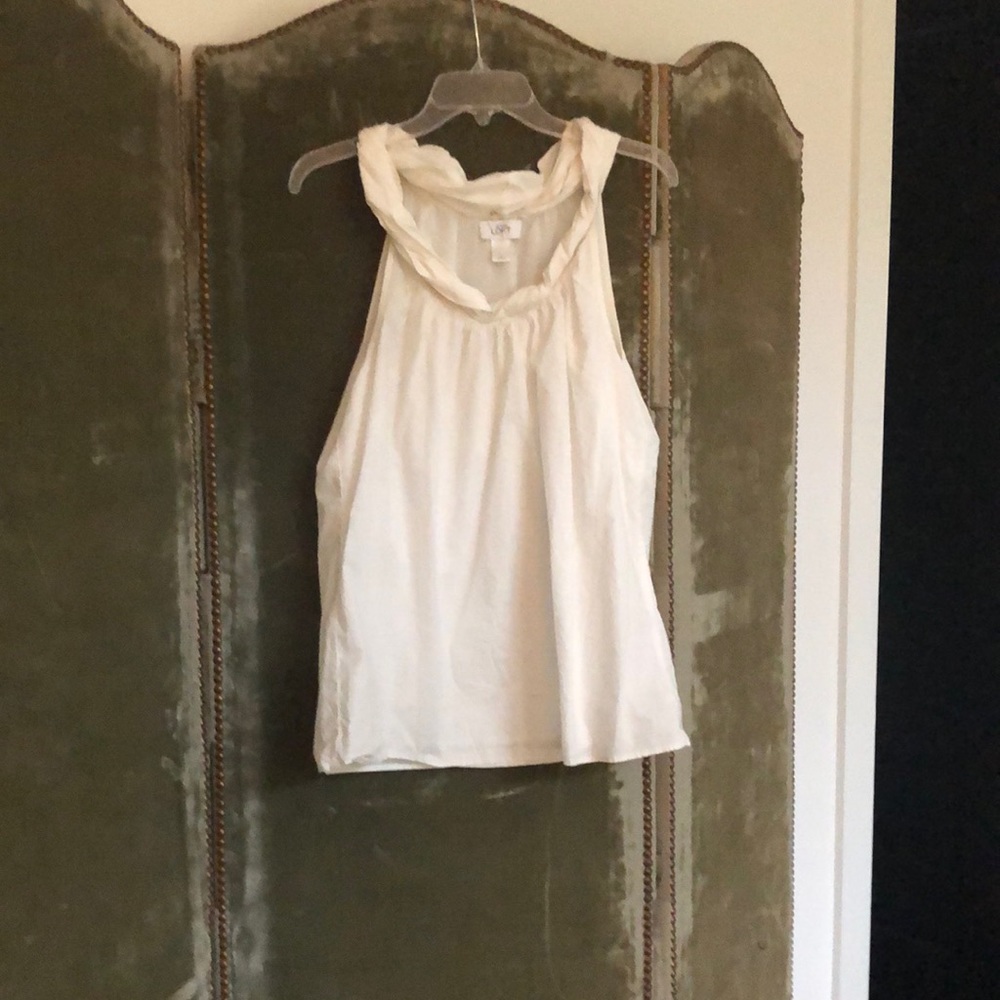 Off white sleeveless blouse